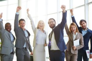 businesspeople celebrating success 1 clean code trainings